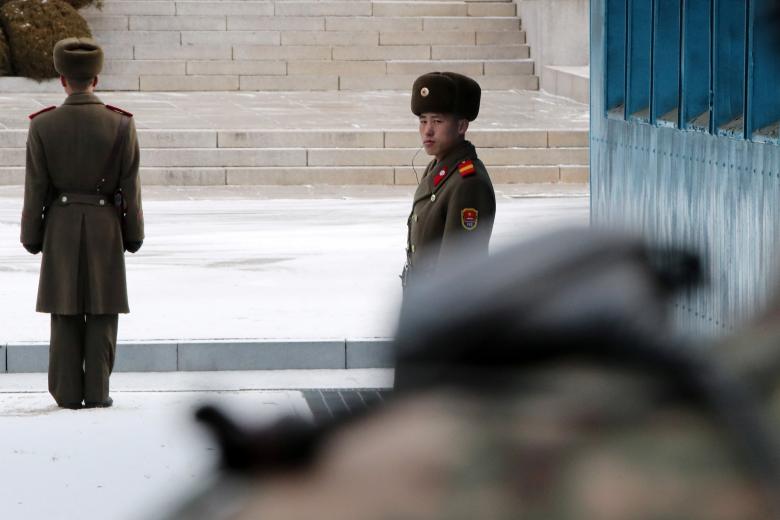 North Korean soldiers stand guard during a high-level talks at the truce village of Panmunjom in the demilitarized zone separating the two Koreas, South Korea.