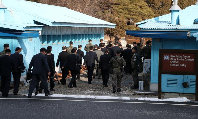 North Korean delegation led by Ri Son Gwon, Chairman of the Committee for the Peaceful Reunification of the Country (CPRC) of DPRK, cross the concrete border as they leave after their meeting at the truce village of Panmunjom in the demilitarized zone se