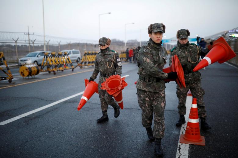 South Korean soldiers place traffic cones at a checkpoint on the Grand Unification Bridge that leads to the truce village of Panmunjom, just south of the demilitarized zone separating the two Koreans, in Paju, South Korea.