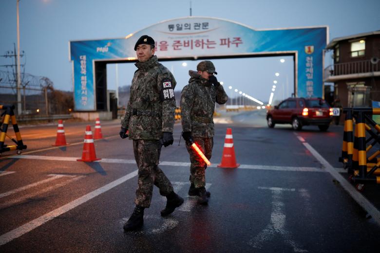 South Korean soldiers stand guard at a check point on the Grand Unification Bridge that leads to the truce village of Panmunjom, just south of the demilitarized zone separating the two Koreans, in Paju, South Korea.