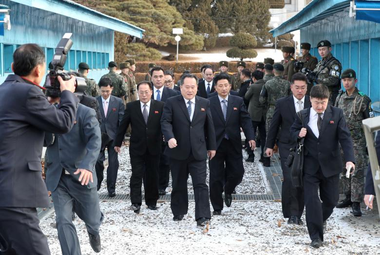 The North Korean delegation led by Ri Son Gwon, Chairman of the Committee for the Peaceful Reunification of the Country (CPRC) of DPRK, cross the concrete border to attend a meeting at the truce village of Panmunjom in the demilitarized zone separating t