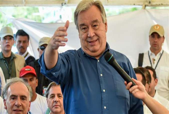 United Nations Secretary General Antonio Guterres (C) speaks during a visit to the Mesetas municipality, Colombia, on January 14, 2018. (Photo by AFP)