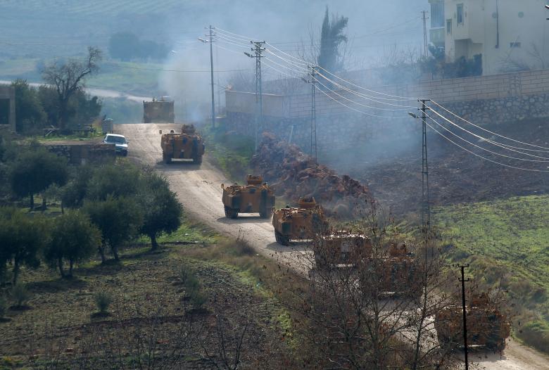 Turkish military armoured vehicles arrive at a border village near the town of Hassa in Hatay province, Turkey.