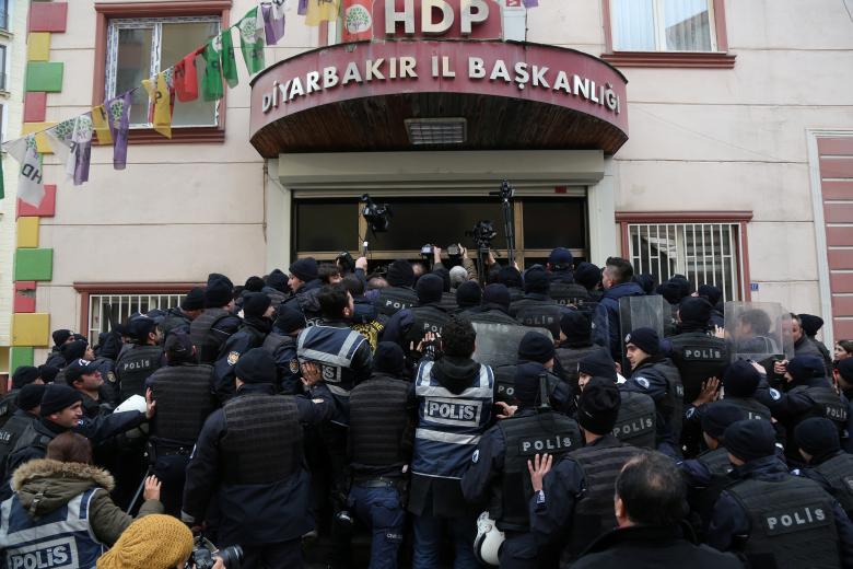 Riot police block the entrance of pro-Kurdish Peoples' Democratic Party (HDP) office in order to prevent party members to go out for a demonstration in the southeastern city of Diyarbakir, Turkey.
