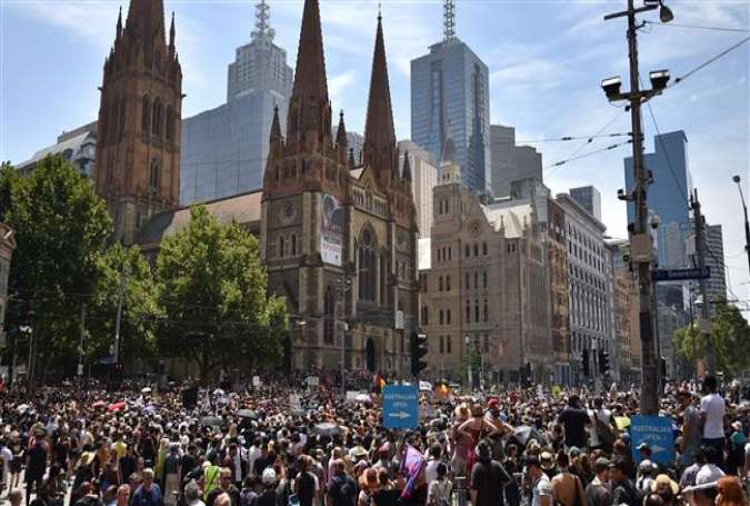 People take part in an "Invasion Day" protest rally on Australia Day, in Melbourne, on January 26, 2018. (Photo by AFP)