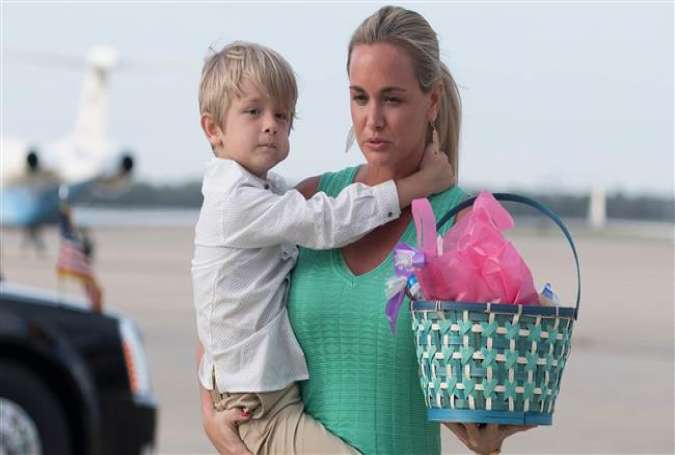 In this AFP file photo taken on April 16, 2017, Vanessa Trump, the wife of Donald Trump, Jr, holds her son Tristan as they walk off Air Force One at Andrews Air Force Base on April 16, 2017.