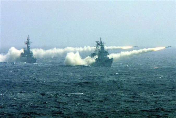 Two warships of the South China Sea Fleet of the Chinese Navy fire missiles during a competitive training.