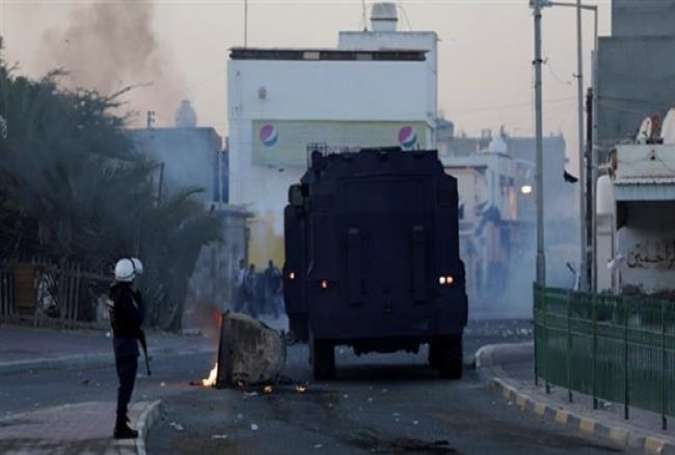 File photo shows Bahraini regime forces attacking protesters in the western village of Shahrakan. (Photo by AP)