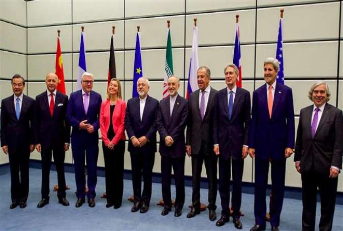 Diplomats from Iran, the P5+1 states and the EU pose for a group photo at the United Nations building in Vienna, Austria, July 14, 2015. (Photo by AP)