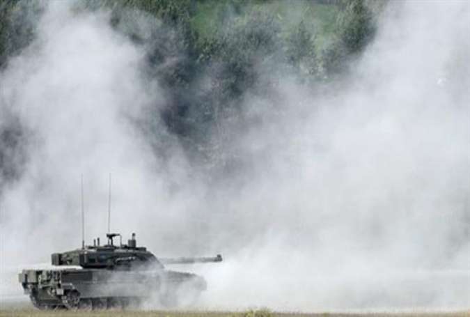 Italian army tank type "Ariete" drive at the training area in Grafenwoehr, near Eschenbach, southern Germany, on May 11, 2016, during the exercise "Strong Europe Tank Challenge 2016."