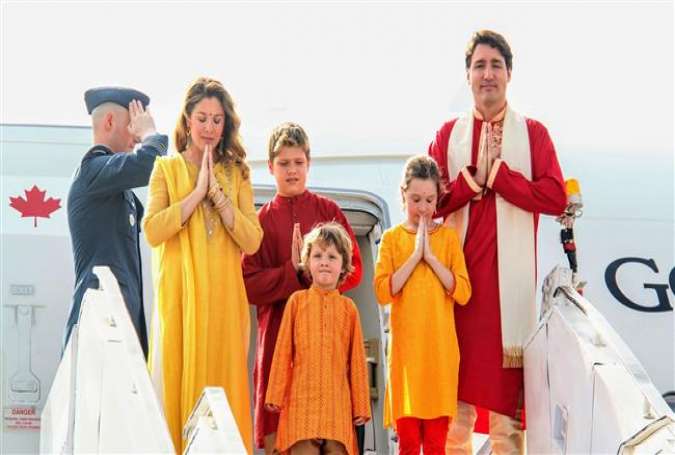 In this photograph, released by the Gujarat Information Bureau on February 19, 2018, Canadian Prime Minister Justin Trudeau (R), his wife Sophie Gregoire Trudeau (2-L), their daughter Ella-Grace (2-R) and their sons Hadrien (C) and Xavier pose for media as they arrive at the airport in the Indian city of Ahmedabad. (Via AFP)