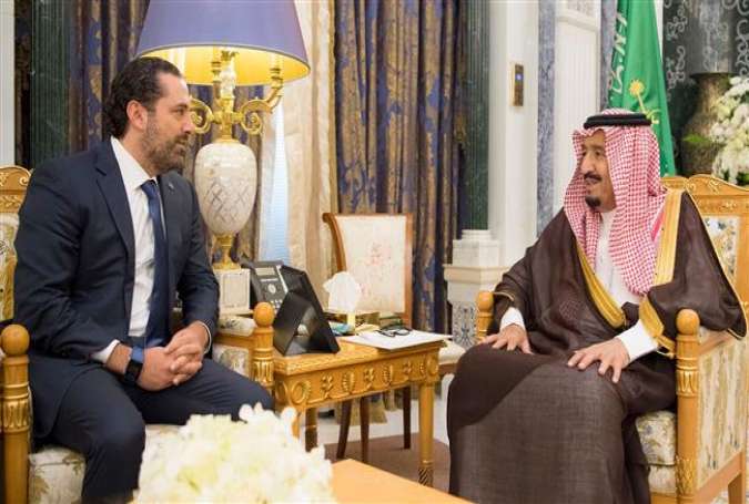 The handout picture provided by the Saudi Royal Palace on November 6, 2017, shows Saudi King Salman bin Abdulaziz Al Saud (R) meeting with Lebanese Prime Minister Saad Hariri in Riyadh. (Via AFP)