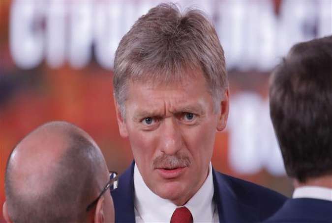The Kremlin spokesman Dmitry Peskov is seen before Russian President Vladimir Putin
