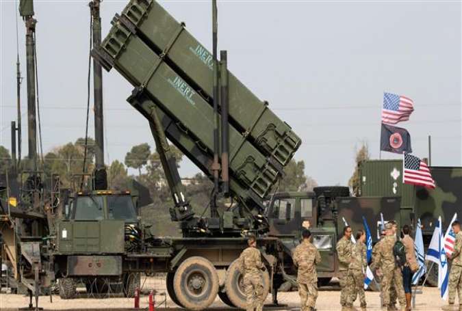 US army officers stands in front a US Patriot missile system during a joint Israeli-US military exercise at the Hatzor Airforce Base on March 8, 2018. (Photo by AFP)