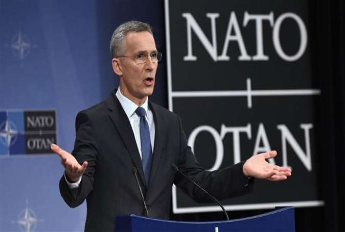 NATO Secretary-General Jens Stoltenberg gestures as he addresses a press conference to give the alliance