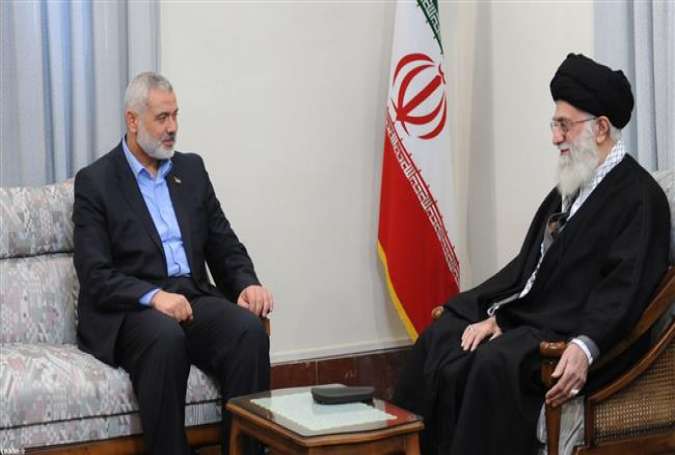 This file photo shows Ismail Haniyeh (L), head of the political bureau of Hamas, during a meeting with Leader of the Islamic Revolution Ayatollah Seyyed Ali Khamenei, in Tehran. (By khamenei.ir)