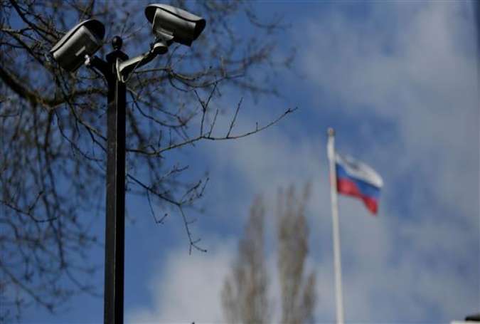 Security cameras and the Russian flag are pictured outside the residence of the consulate general of Russia at the historic Samuel Hyde House in Seattle, Washington, on April 2, 2018. (Photo by AFP)