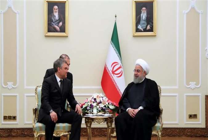 Iranian President Hassan Rouhani (R) and Chairman of Russia