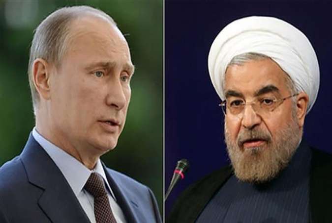 Iranian President Hassan Rouhani (R) and his Russian counterpart, Vladimir Putin