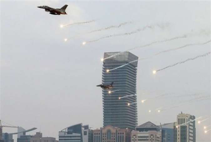 This file photo shows Emirati fighter jets firing flares as they perform in an airshow above the Abu Dhabi Corniche.