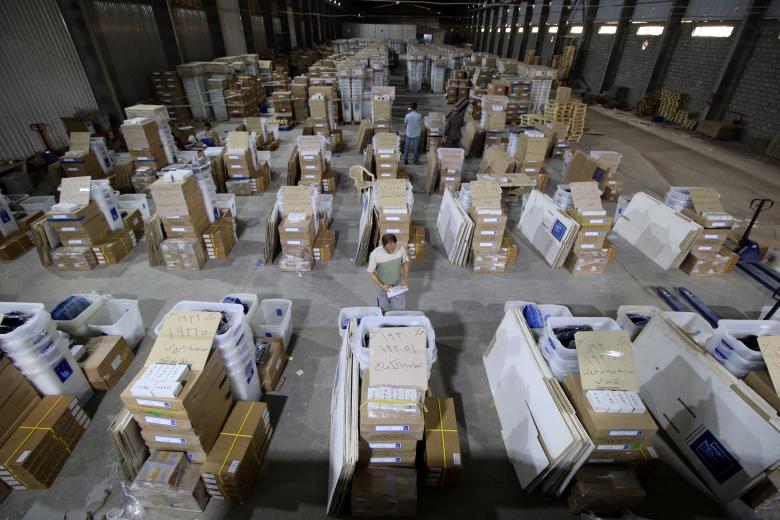 Employees of Iraqi Independent High Electoral Commission inspect voting materials at a warehouse in Basra. Picture taken May 3.
