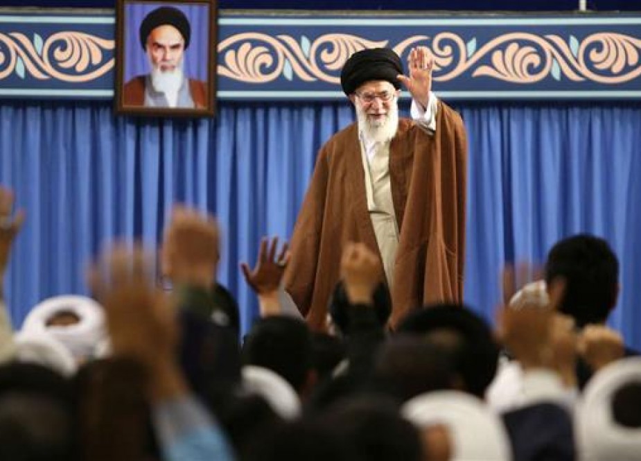 Leader of the Islamic Revolution Ayatollah Seyyed Ali Khamenei waves to participants at an international summit on the Shia role in the emergence and development of Islamic sciences, in Tehran