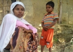 Rohingya refugee Jamalida Begum and her seven-year-old son Mohammad Ayaz at a refugee camp in Bangladesh. She fled Myanmar after speaking to journalists in 2016. (Photo by Guardian)
