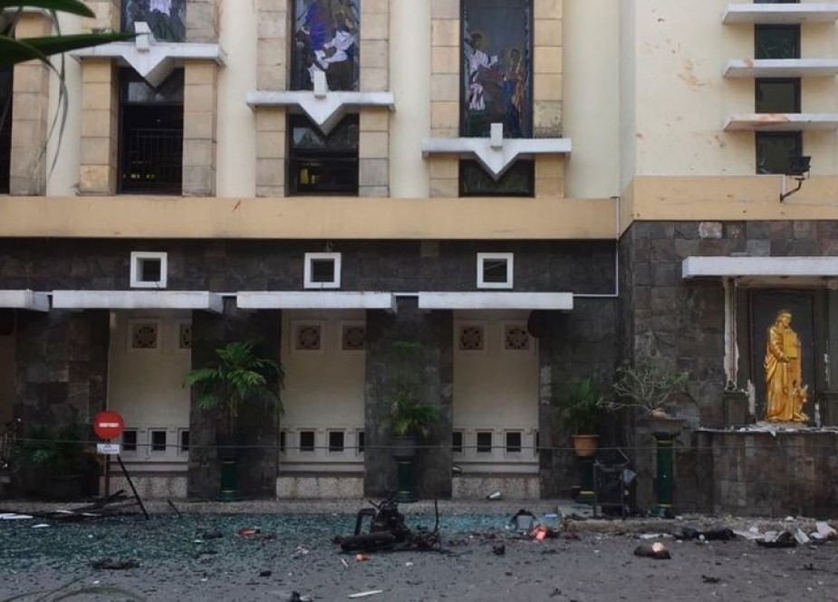 Debris are seen outside Santa Maria church where an explosion went off in Surabaya, East Java, Indonesia