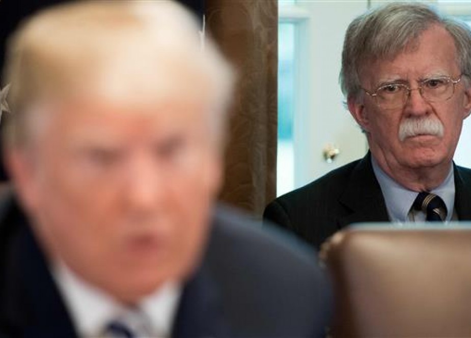 US President Donald Trump speaks alongside National Security Adviser John Bolton (R) during a Cabinet Meeting in the Cabinet Room of the White House in Washington, DC, May 9, 2018. (Photo by AFP)