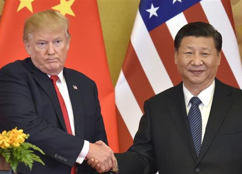 Donald Trump and Chinese President Xi Jinping shake hands at a joint news conference held after their meeting in Beijing on Nov. 9, 2017. (Getty Images)