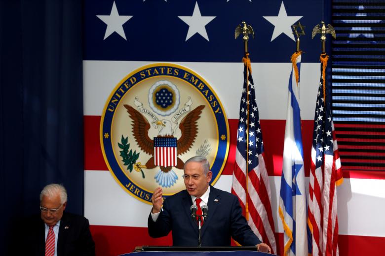 Israeli Prime Minister Benjamin Netanyahu speaks as U.S. Ambassador to Israel David Friedman sits next to him.