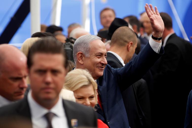 Israeli Prime Minister Benjamin Netanyahu waves as he arrives at the dedication ceremony.