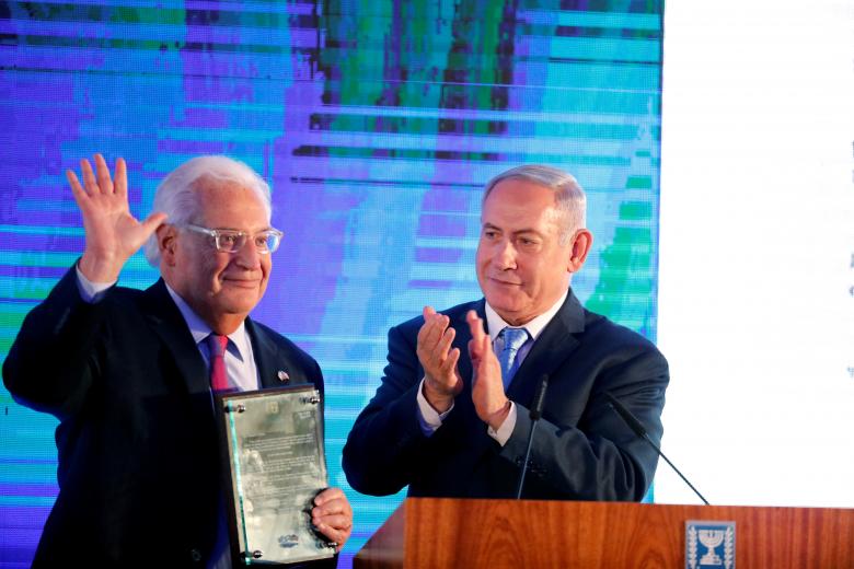 Israeli Prime Minister Benjamin Netanyahu claps after handing U.S. Ambassador to Israel David Friedman a letter of appreciation, during a reception held at the Israeli Ministry of Foreign Affairs in Jerusalem, ahead of the moving of the U.S. embassy, May