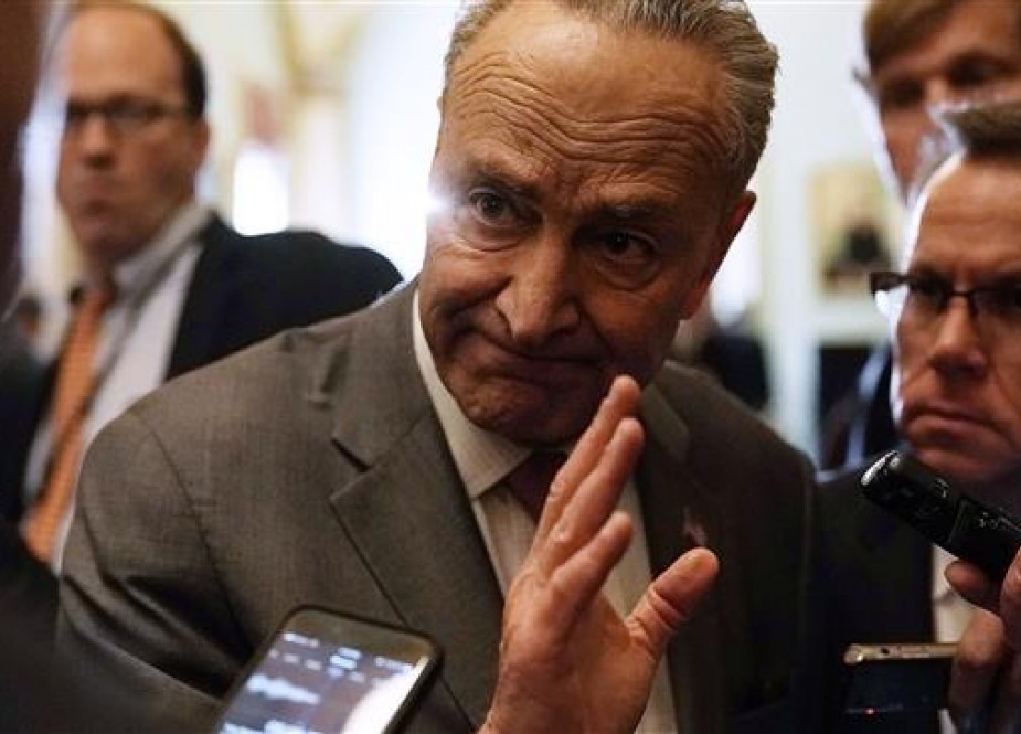 New York Democratic Senator Chuck Schumer speaks to members of the media after a news briefing at the Capitol May 8, 2018 in Washington, DC.