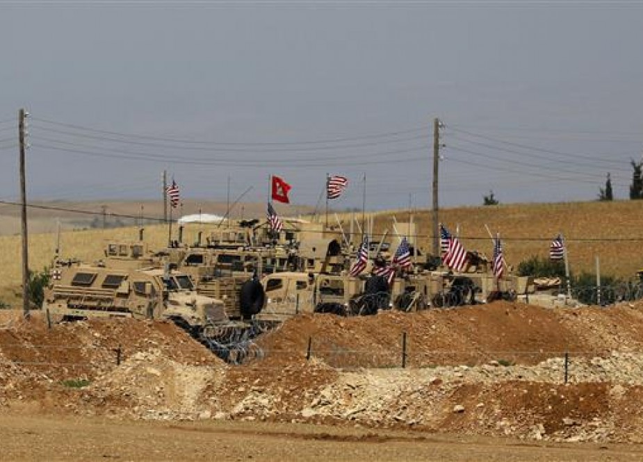 The picture taken on May 8, 2018 shows vehicles of the US-led coalition forces in Manbij, Syria.