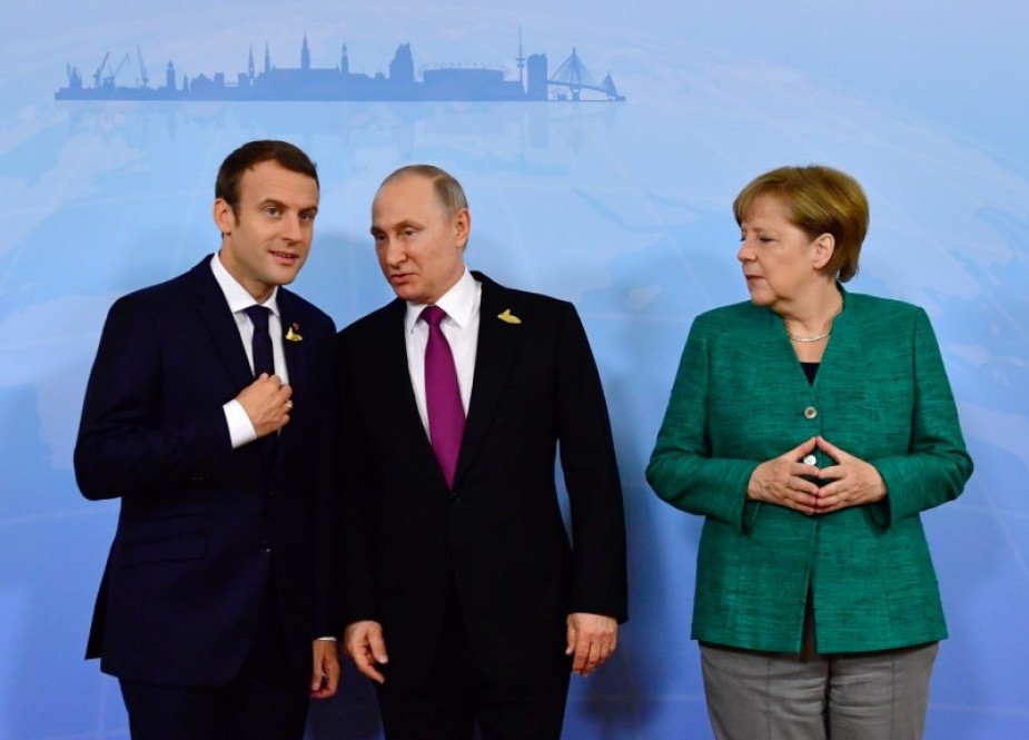 French President Emmanuel Macron, Russian President Vladimir Putin and German Chancellor Angela Merkel.jpg