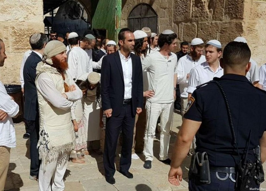 Israeli settlers, backed by IOF, while stroming Al-Aqsa Mosque