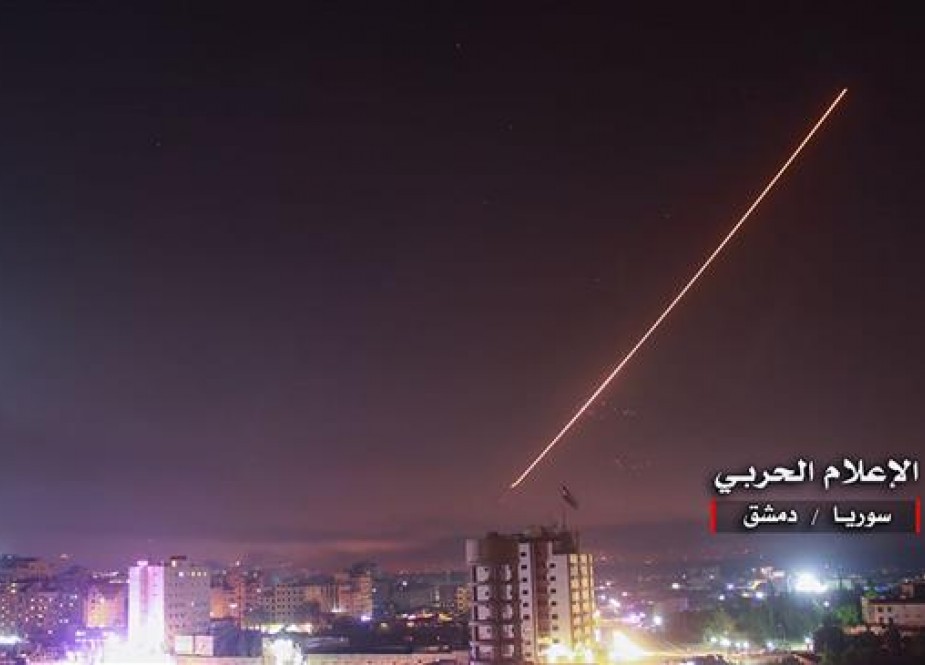 An image released on May 10, 2018 by the government-affiliated "Central War Media" in Syria shows Syrian air defense systems intercepting Israeli missiles over Damascus. (Via AFP)