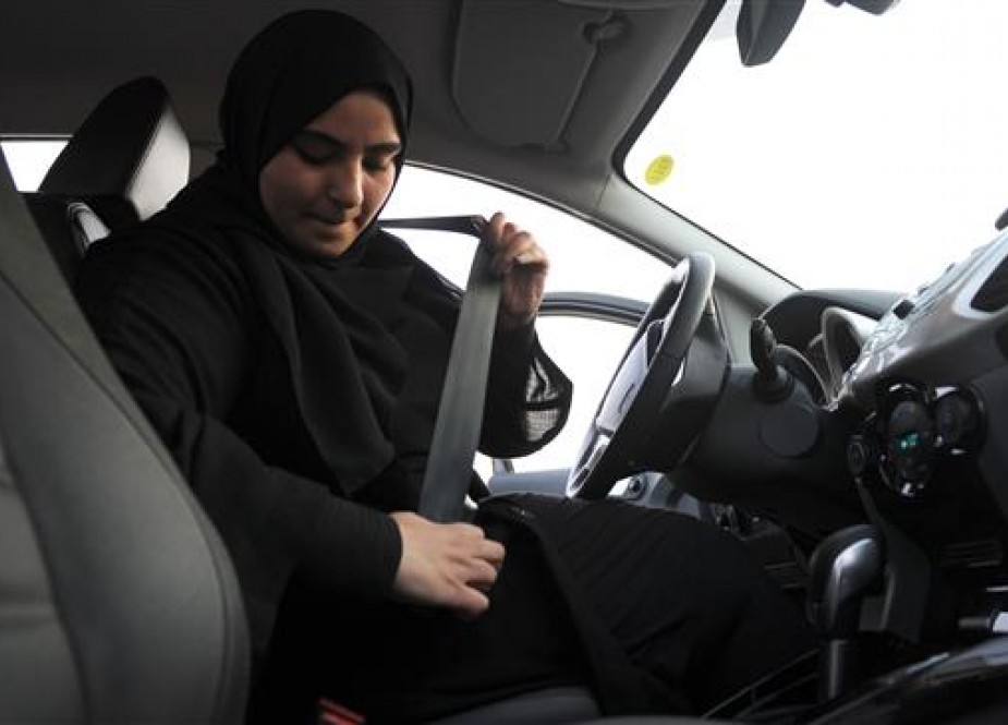 Saudi woman puts on her seatbelt during a driving lesson in the port city of Jeddah.jpg