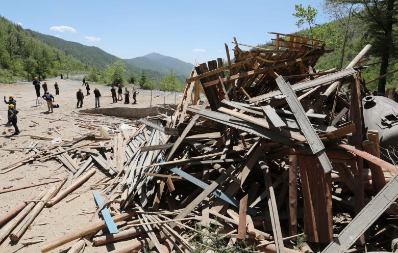 Journalists and North Korean officials look around the site where the second tunnel and an observatory of Punggye-ri nuclear test ground were blown up. North Korea did not allow experts to witness the dismantlement of the site, which meant there was no o