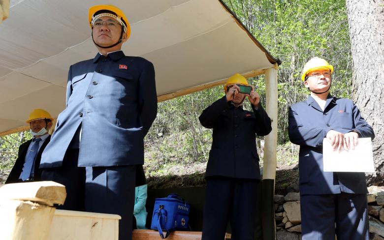 North Korean officials watch the dismantlement process of Punggye-ri nuclear test ground.