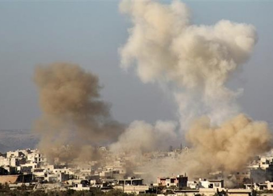 The picture shows smoke billowing from buildings in the Shia-majority town of al-Foua, in Syria