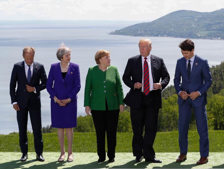 European Council President Donald Tusk, Britain's Prime Minister Theresa May, Germany's Chancellor Angela Merkel, U.S. President Donald Trump and Canada's Prime Minister Justin Trudeau pose during a family photo.
