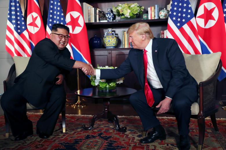 President Donald Trump shakes hands with North Korea's leader Kim Jong Un before their bilateral meeting at the Capella Hotel on Sentosa island in Singapore.
