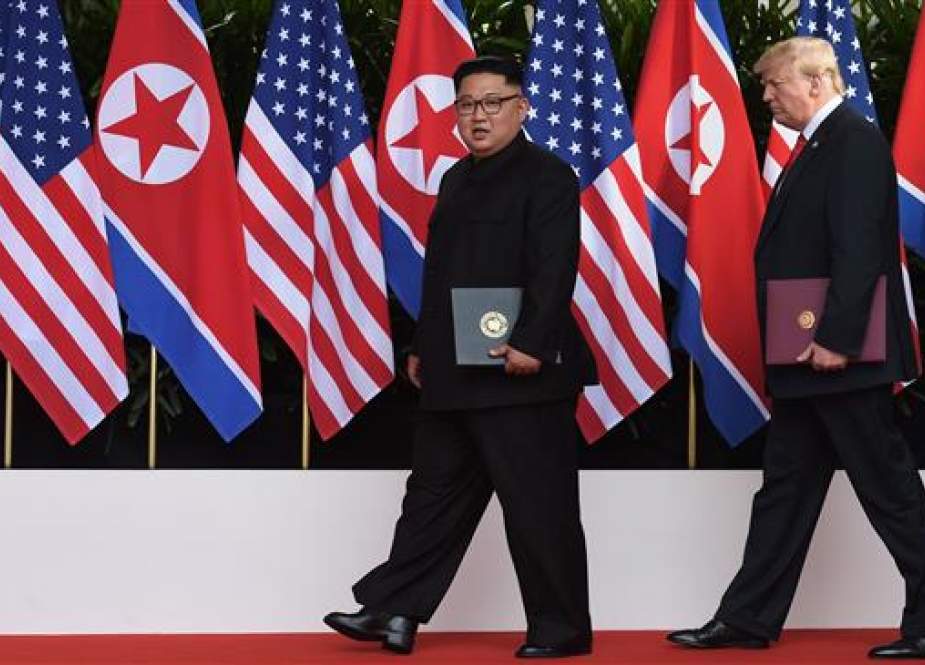 US President Donald Trump (R) walks out with North Korea