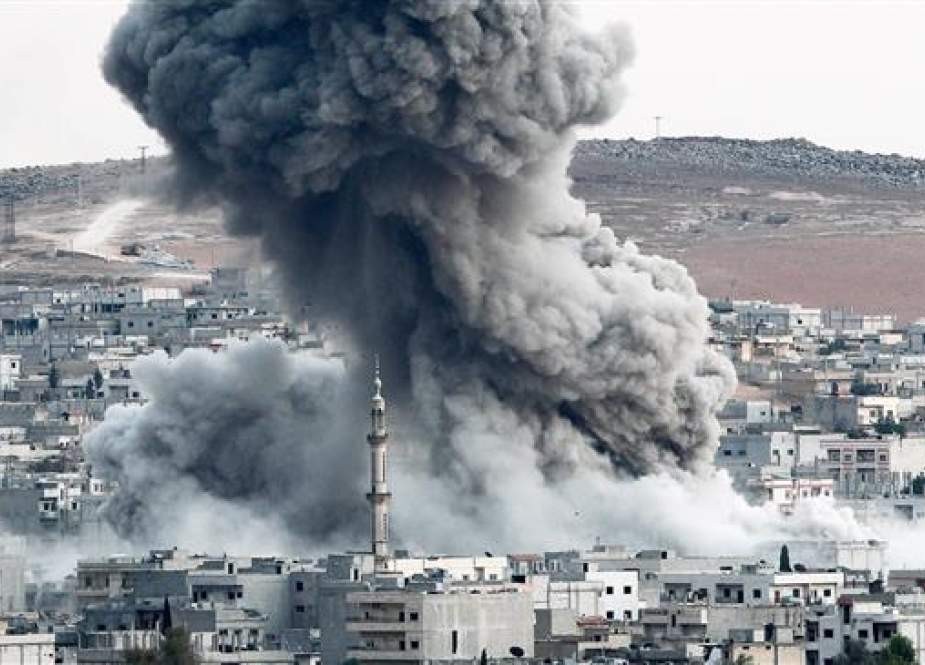 In this file photo, heavy smoke rises from Kobani, Syria, following an airstrike by the US-led coalition there. (Photo by Getty Images)