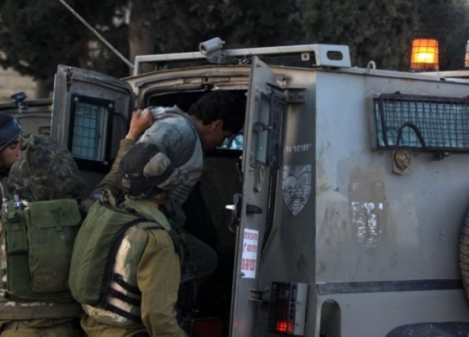 IOF arrests Palestinian young man.jpg
