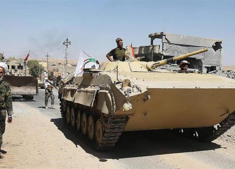 Armored vehicles and bulldozers of the Hashed Al-Shaabi (Popular Mobilization units) advance through the town of Tal Afar, west of Mosul, Iraq on August 26, 2017. (Photo by AFP)
