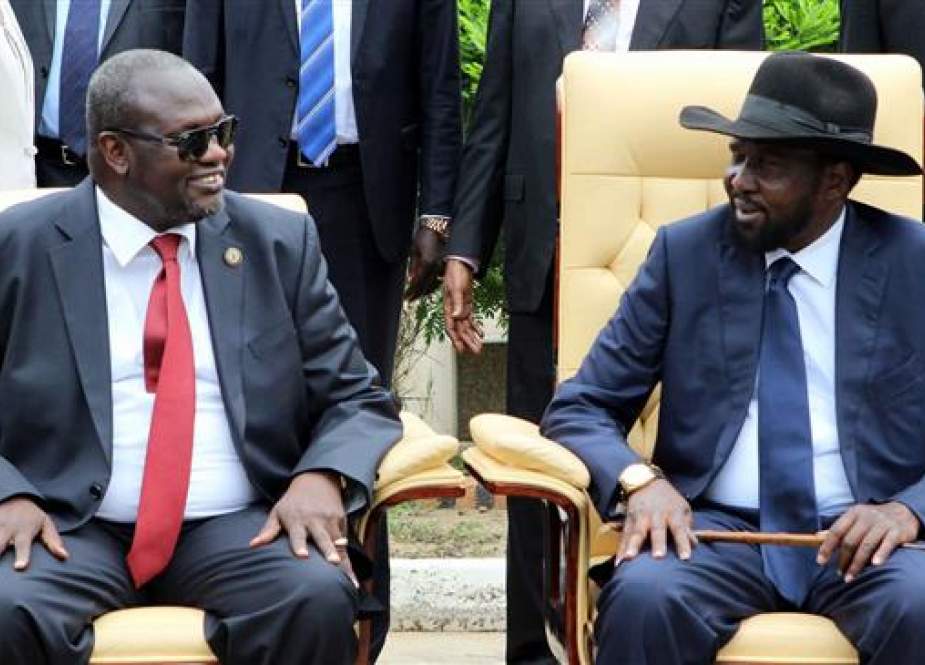 This file photo shows South Sudan’s President Salva Kiir (R) and now-rebel leader Riek Machar attending a government ceremony in the capital, Juba.