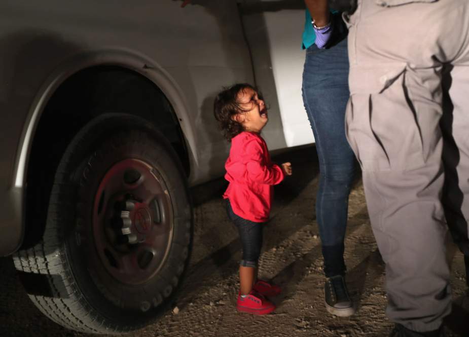 Two-year-old Honduran asylum seeker cries.png
